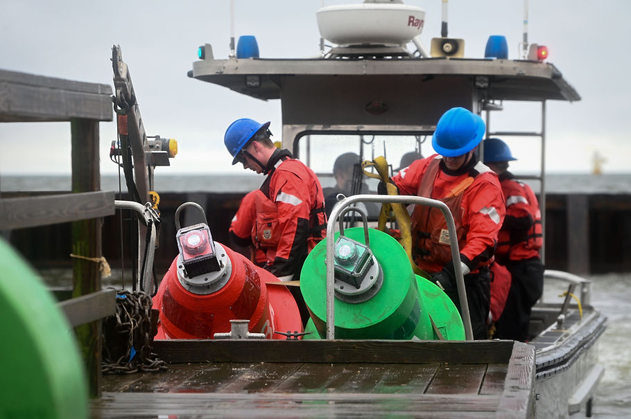 U.S. Coast Guard Aids to Navigation Team (ANT) Baltimore drops buoy channel markers in the Patapsco River in Baltimore, Maryland, April 2, 2024