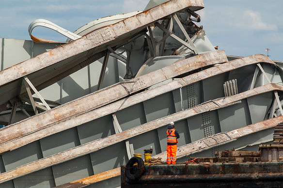 A salvage operator assesses debris as salvage operations continue in Baltimore on April 6, 2024