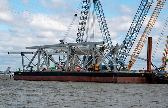 Response personnel prepare debris from the Francis Scott Key Bridge for removal from the Patapsco River, April 6, 2024