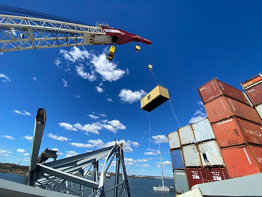 Response crews began removing shipping containers using a floating crane barge at the site of the Francis Scott Key Bridge on April 7, 2024