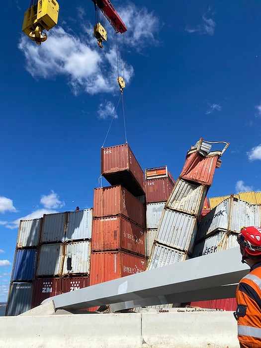 Response crews began removing shipping containers using a floating crane barge at the site of the Francis Scott Key Bridge on April 7, 2024