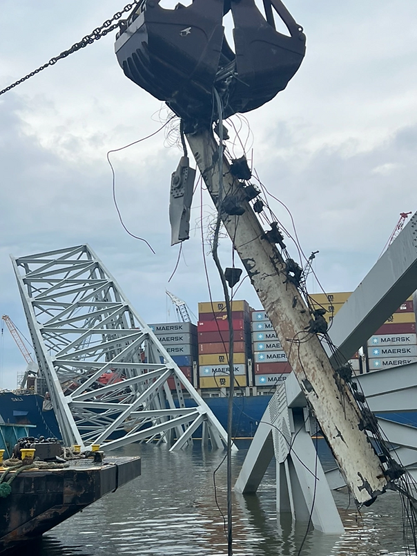 Contracted salvors continue to remove bridge wreckage from the Patapsco River in efforts to reopen the shipping channel in Baltimore, April 10, 2024