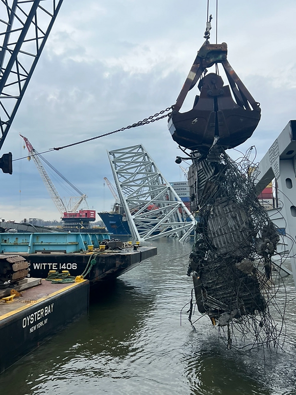 Contracted salvors continue to remove bridge wreckage from the Patapsco River in efforts to reopen the shipping channel in Baltimore, April 10, 2024